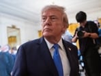 Trump signs an executive order in the Oval Office calling for the MMR vaccine to be split into three separate shots. Trump signs an executive order in the Oval Office calling for the MMR vaccine to be split into three separate shots.