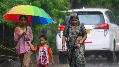Commuters were seen moving about during the rain in the afternoon in Noida. ( Sunil Ghosh / Hindustan Times) Commuters were seen moving about during the rain in the afternoon in Noida. ( Sunil Ghosh / Hindustan Times)