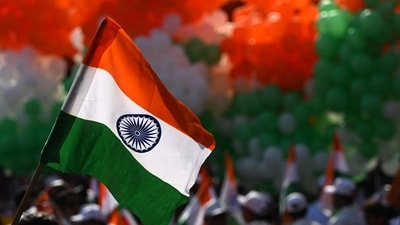 A volunteer holds an Indian national flag during a tricolour campaign in Kolkata on August 10, 2026 ahead of country's 80th Independence Day on August 15. (AFP) A volunteer holds an Indian national flag during a tricolour campaign in Kolkata on August 10, 2026 ahead of country's 80th Independence Day on August 15. (AFP)