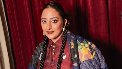 Dressed in a whimsically embroidered silk ensemble by designer Shruti Sancheti paired with schoolgirl braids, a bindi, and hand-painted metallic charms, she offered a lesson in blending old-world craft with modern style. (Photo: Raajessh Kashyap/HT)