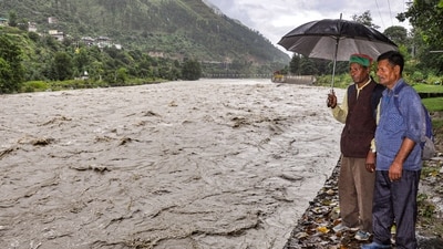 People look at the swollen Beas river as the water level rises following incessant monsoon rain, in Kullu, Himachal Pradesh. (PTI) People look at the swollen Beas river as the water level rises following incessant monsoon rain, in Kullu, Himachal Pradesh. (PTI)
