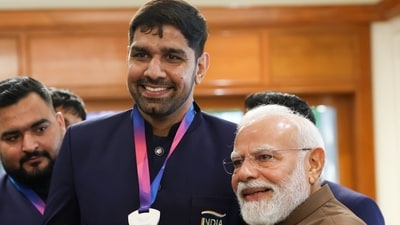 Prime Minister Narendra Modi with boxer Narender Berwal during a felicitation ceremony for India's Glasgow 2026 Commonwealth Games contingent at the Prime Minister's residence (PMO) Prime Minister Narendra Modi with boxer Narender Berwal during a felicitation ceremony for India's Glasgow 2026 Commonwealth Games contingent at the Prime Minister's residence (PMO)