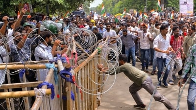 Security personnel stand guard as people march towards the Jharkhand assembly amid a protest over alleged irregularities in state recruitment examinations, in Ranchi on Monday, August 10, 2026. (PTI) Security personnel stand guard as people march towards the Jharkhand assembly amid a protest over alleged irregularities in state recruitment examinations, in Ranchi on Monday, August 10, 2026. (PTI)