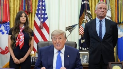President Donald Trump speaks as Health and Human Services Secretary Robert F. Kennedy Jr., right, and Jayme Franklin listen during a meeting to sign an executive order about vaccines in the Oval Office of the White House in Washington. President Donald Trump speaks as Health and Human Services Secretary Robert F. Kennedy Jr., right, and Jayme Franklin listen during a meeting to sign an executive order about vaccines in the Oval Office of the White House in Washington.