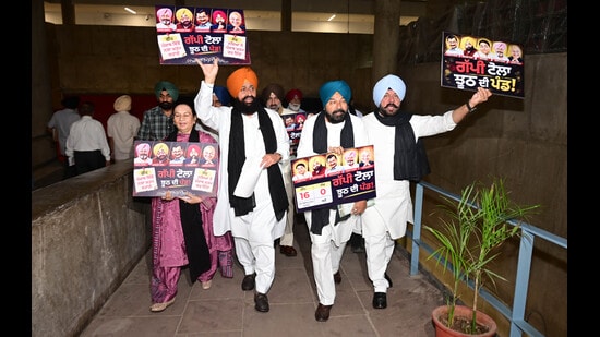 Leader of Opposition Partap Singh Bajwa and other Congress MLAs protesting against the state government on the last day of the monsoon session of the Punjab Legislature in Chandigarh on Monday. (Ravi Kumar/ HT)