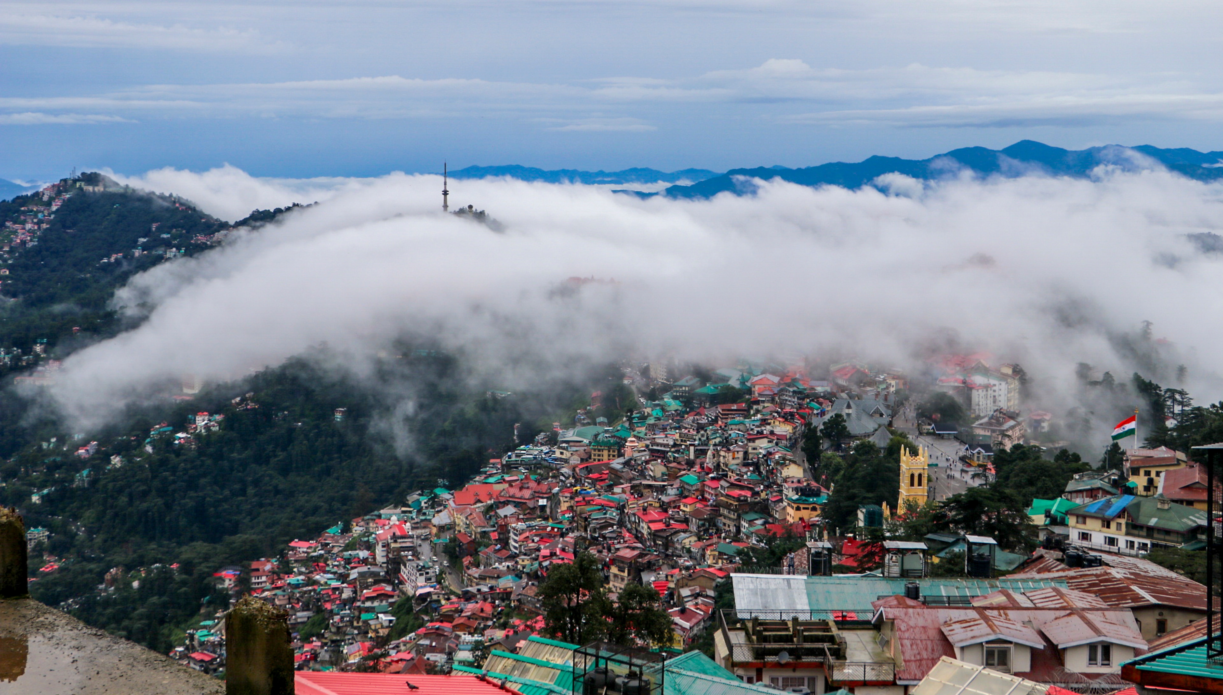 Clouds hover over the city skyline following rainfall, in Shimla, Himachal Pradesh. (PTI) Clouds hover over the city skyline following rainfall, in Shimla, Himachal Pradesh. (PTI)