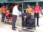 Medical personnel present with an injured crew member of Air India Phuket-Delhi flight that lost altitude last week.
