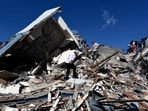 Rescuers look for survivors amid the rubble of a collapsed building after an earthquake in Pereira, Colombia after a 7.4 magnitude earthquake brought great devastation and destruction(AFP)