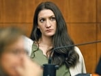 Lindsay Clancy waits for the judge to call a prospective jury member into court in her murder trial where she is charged in the 2023 killing of her three children.(AP)