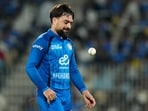Rashid Khan tosses the ball in the air as he prepares to bowl during a match between Afghanistan and India. Rashid Khan tosses the ball in the air as he prepares to bowl during a match between Afghanistan and India.