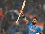 India's Virat Kohli celebrates after scoring a century (100 runs) during the 2023 ICC Men's Cricket World Cup one-day international (ODI) match between India and Bangladesh at the Maharashtra Cricket Association Stadium in Pune on October 19, 2023. (Photo by Punit PARANJPE / AFP) / -- IMAGE RESTRICTED TO EDITORIAL USE - STRICTLY NO COMMERCIAL USE -- (AFP) India's Virat Kohli celebrates after scoring a century (100 runs) during the 2023 ICC Men's Cricket World Cup one-day international (ODI) match between India and Bangladesh at the Maharashtra Cricket Association Stadium in Pune on October 19, 2023. (Photo by Punit PARANJPE / AFP) / -- IMAGE RESTRICTED TO EDITORIAL USE - STRICTLY NO COMMERCIAL USE -- (AFP)