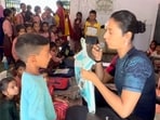 Khushboo Patani promises new school bags to students.
