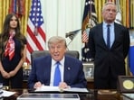 President Donald Trump speaks as Health and Human Services Secretary Robert F. Kennedy Jr., right, and Jayme Franklin listen during a meeting to sign an executive order about vaccines in the Oval Office of the White House in Washington. 