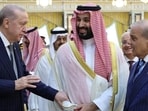 Turkish President Tayyip Erdogan, Saudi Crown Prince Mohammed bin Salman and Pakistan's Prime Minister Shehbaz Sharif chat after signing a joint defence agreement in Saudi Arabia, August 7 (via REUTERS)