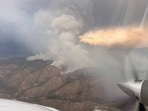 With the Frijoles Fire expanding rapidly to 4,158 acres, Cundiyo residents face mandatory evacuations. Firefighters are striving to contain the blaze, while residents gather emergency bags.