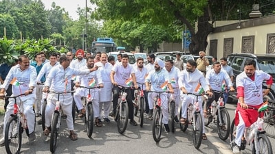 AAP MLAs Saurabh Bharadwaj and Sanjeev Jha, along with others, cycle to the Delhi Assembly as part of a symbolic protest against the alleged bicycle scam in the Delhi government, near Ambedkar Memorial, Civil Lines, in New Delhi on Monday. (vipin kumar) AAP MLAs Saurabh Bharadwaj and Sanjeev Jha, along with others, cycle to the Delhi Assembly as part of a symbolic protest against the alleged bicycle scam in the Delhi government, near Ambedkar Memorial, Civil Lines, in New Delhi on Monday. (vipin kumar)