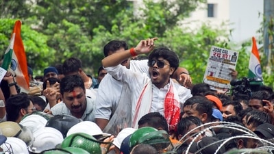 Protesters being restricted by security personnel during students' march towards Jharkhand Assembly to protest against the government over alleged JPSC and JSSC-CGL examination paper leak, in Ranchi. (ANI Photo) Protesters being restricted by security personnel during students' march towards Jharkhand Assembly to protest against the government over alleged JPSC and JSSC-CGL examination paper leak, in Ranchi. (ANI Photo)