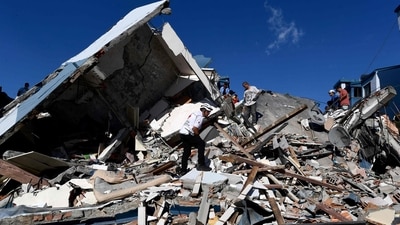 Rescuers look for survivors amid the rubble of a collapsed building after an earthquake in Pereira, Colombia after a 7.4 magnitude earthquake brought great devastation and destruction (AFP) Rescuers look for survivors amid the rubble of a collapsed building after an earthquake in Pereira, Colombia after a 7.4 magnitude earthquake brought great devastation and destruction (AFP)
