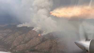 With the Frijoles Fire expanding rapidly to 4,158 acres, Cundiyo residents face mandatory evacuations. Firefighters are striving to contain the blaze, while residents gather emergency bags. (X@SantafeNF) With the Frijoles Fire expanding rapidly to 4,158 acres, Cundiyo residents face mandatory evacuations. Firefighters are striving to contain the blaze, while residents gather emergency bags. (X@SantafeNF)