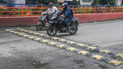 Speed breakers are intentionally painted in contrasting colours to improve visibility. Speed breakers are intentionally painted in contrasting colours to improve visibility.
