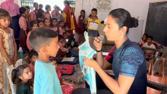 Khushboo Patani promises new school bags to students.