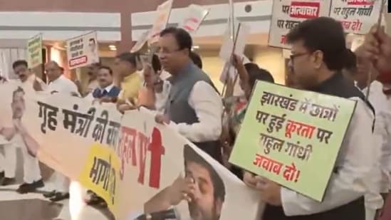 NDA MPs hold protest march towards Parliament's Makar Dwar carrying placards against the Opposition.