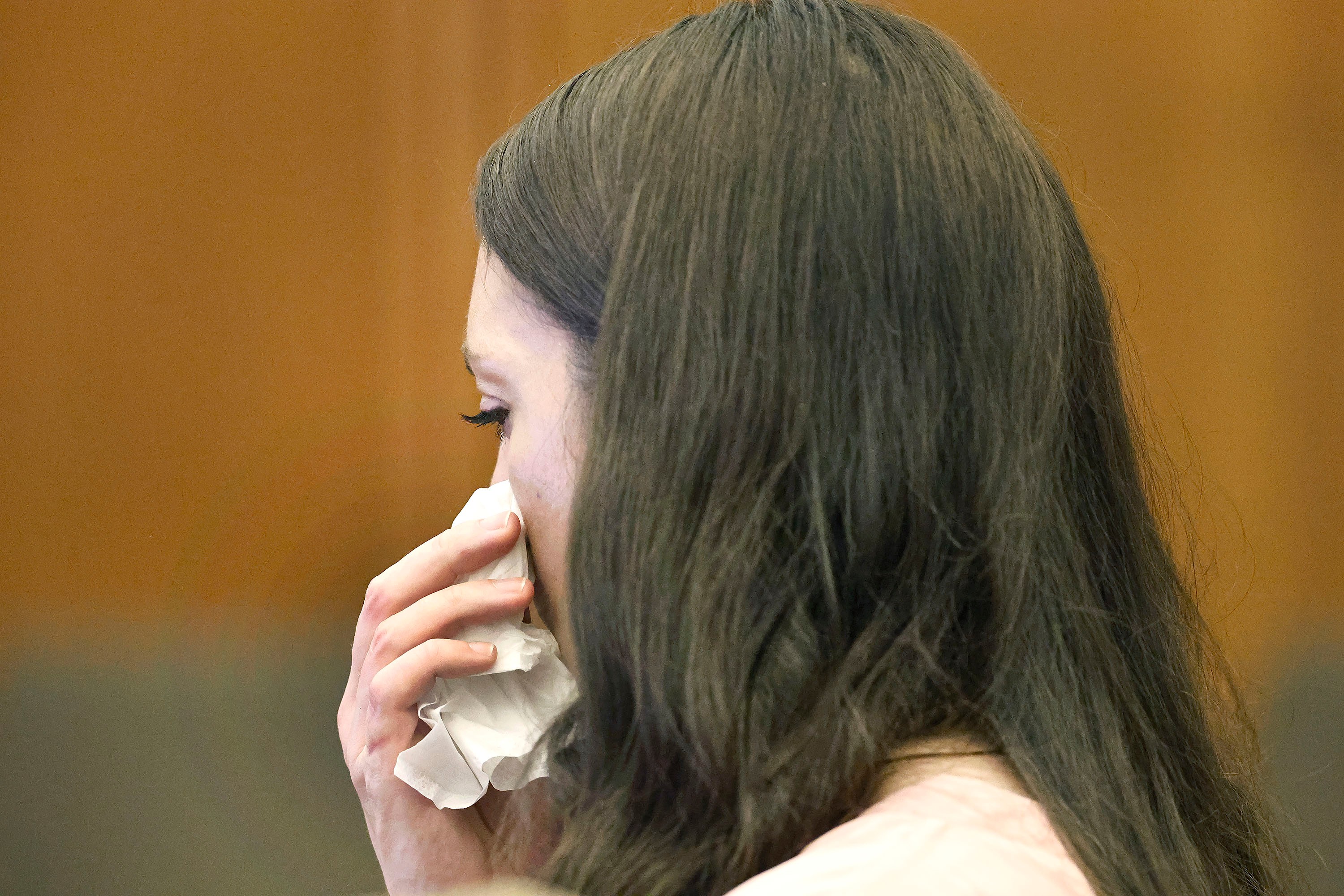 Lindsay Clancy fights back tears as the details of her children's death are read in court at Plymouth Superior Court. (AP)