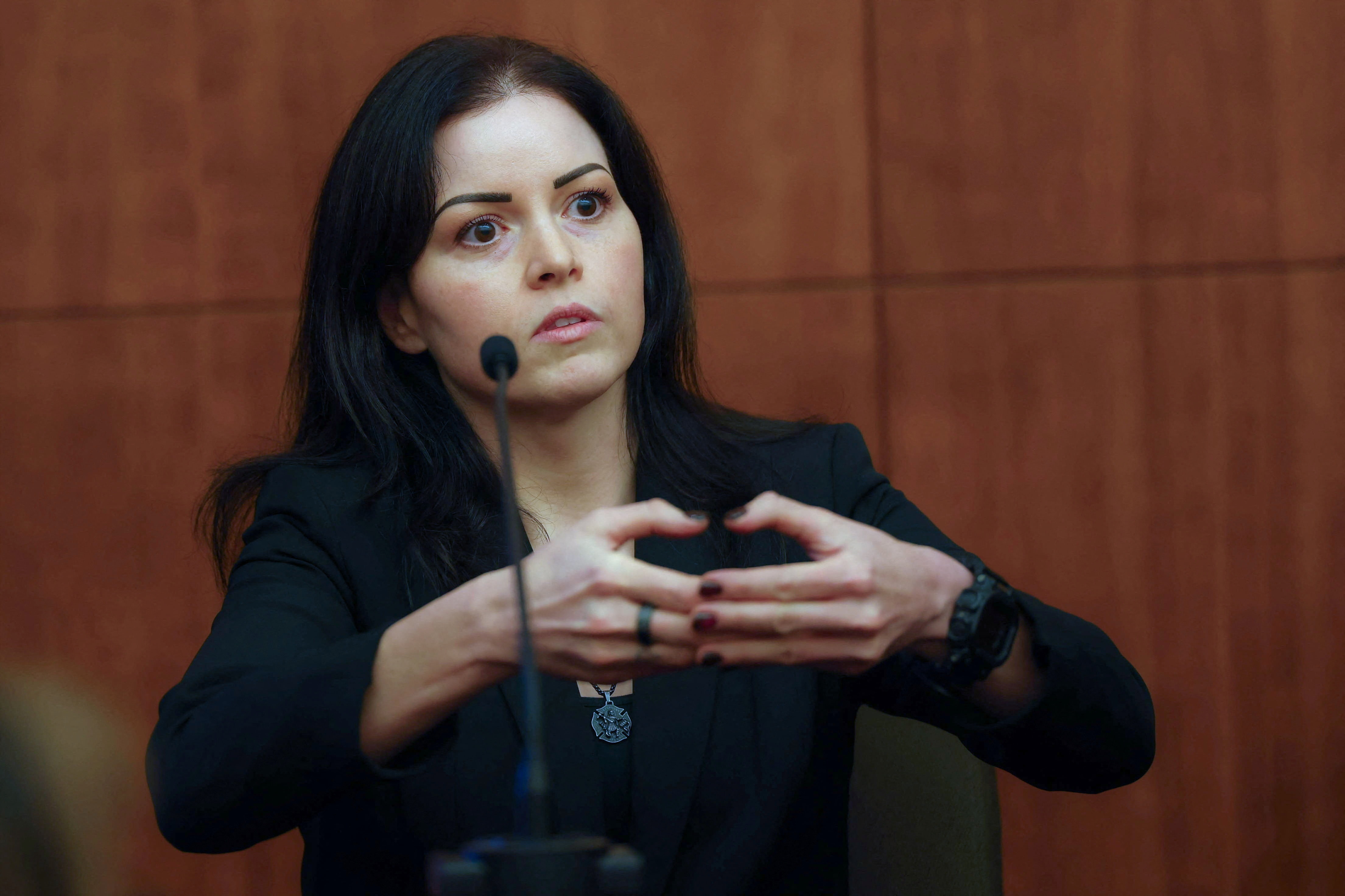 Duxbury firefighter Jennifer Stratton gestures as she testifies during the murder trial of Lindsay Clancy. (Reuters)