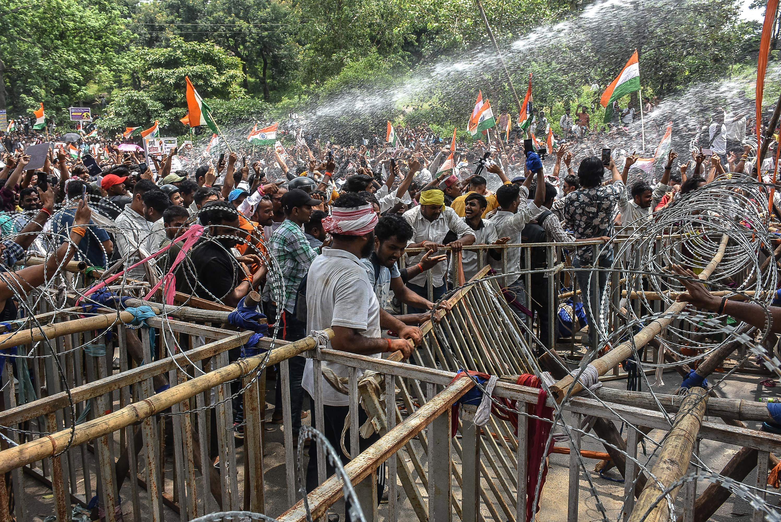 Police resorted to lathi charge and use of water cannons to disperse the crowd from outside the Jharkhand legislative assembly. (AFP) Police resorted to lathi charge and use of water cannons to disperse the crowd from outside the Jharkhand legislative assembly. (AFP)