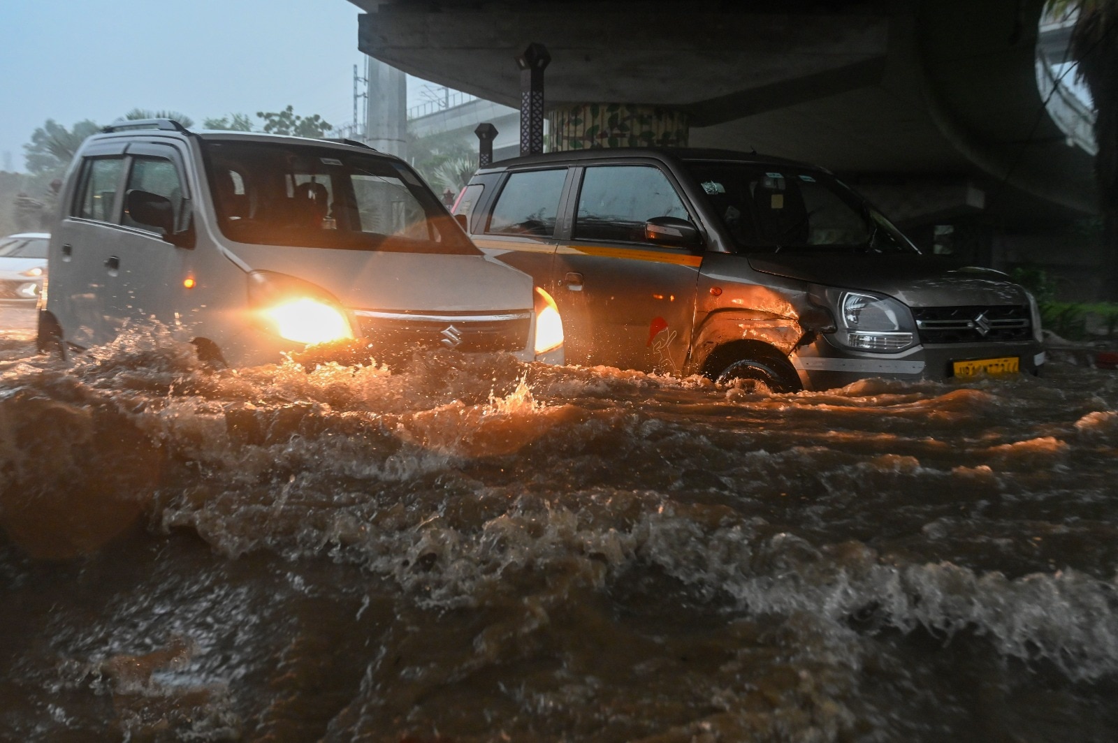 A heavy spell of rain in the afternoon further compounded the issue, inundating roads and resulting in several vehicles breaking down. (HT Photo/Sunil Ghosh)
