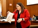 Prosecutor Jennifer Sprague of the Plymouth County DA's office enters a bag of prescription pills into evidence that were prescribed to Lindsay Clancy, who is accused of killing her children, during her murder trial at Plymouth Superior Court, in Plymouth, Massachusetts, U.S., July 27, 2026. Greg Derr/Pool via REUTERS(via REUTERS)
