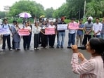 Members of PSU Lalkaar, along with other students, protest against the fee hike at the main gate of the Panjab University V-C’s office on Tuesday. (HT Photo)