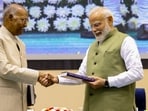 Prime Minister Narendra Modi with former president Ram Nath Kovind during the launch of latter's autobiography.