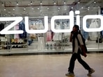 FILE PHOTO: A woman passes in front of the Indian fashion retailer Trent's flagship brand Zudio showroom in New Delhi, India, April 8, 2025. REUTERS/Priyanshu Singh/File Photo