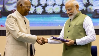 Prime Minister Narendra Modi with former president Ram Nath Kovind during the launch of latter's autobiography. (PMO) Prime Minister Narendra Modi with former president Ram Nath Kovind during the launch of latter's autobiography. (PMO)