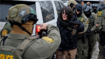 US ICE plans $20M electric shock gloves for officers. (REUTERS)