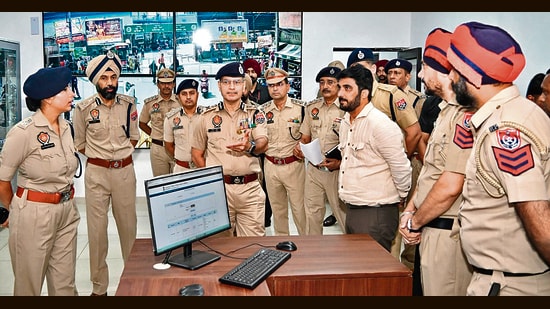 Punjab DGP Gaurav Yadav interacting with police personnel at the integrated command and control centre on Wednesday. (HT PHOTO)