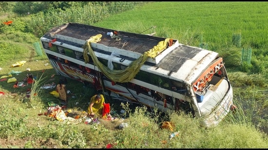 The bus that overturned in Lakhimpur Kheri on Wednesday. (HT)