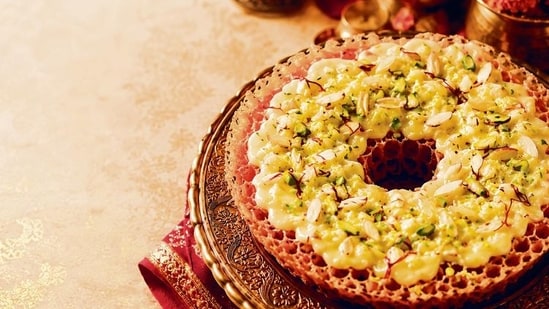 As #ghewar crosses 55k mentions on Instagram and ‘How to make ghewar at home’ ranks among Google’s most searched queries, home cooks are trying to recreate it. (Adobe Stock)