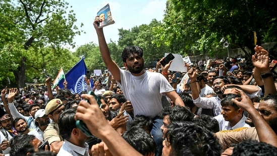 File photo: Cockroach Janta Party (CJP) founder Abhijeet Dipke (C) during the protest over alleged irregularities at Jantar Mantar (AFP)