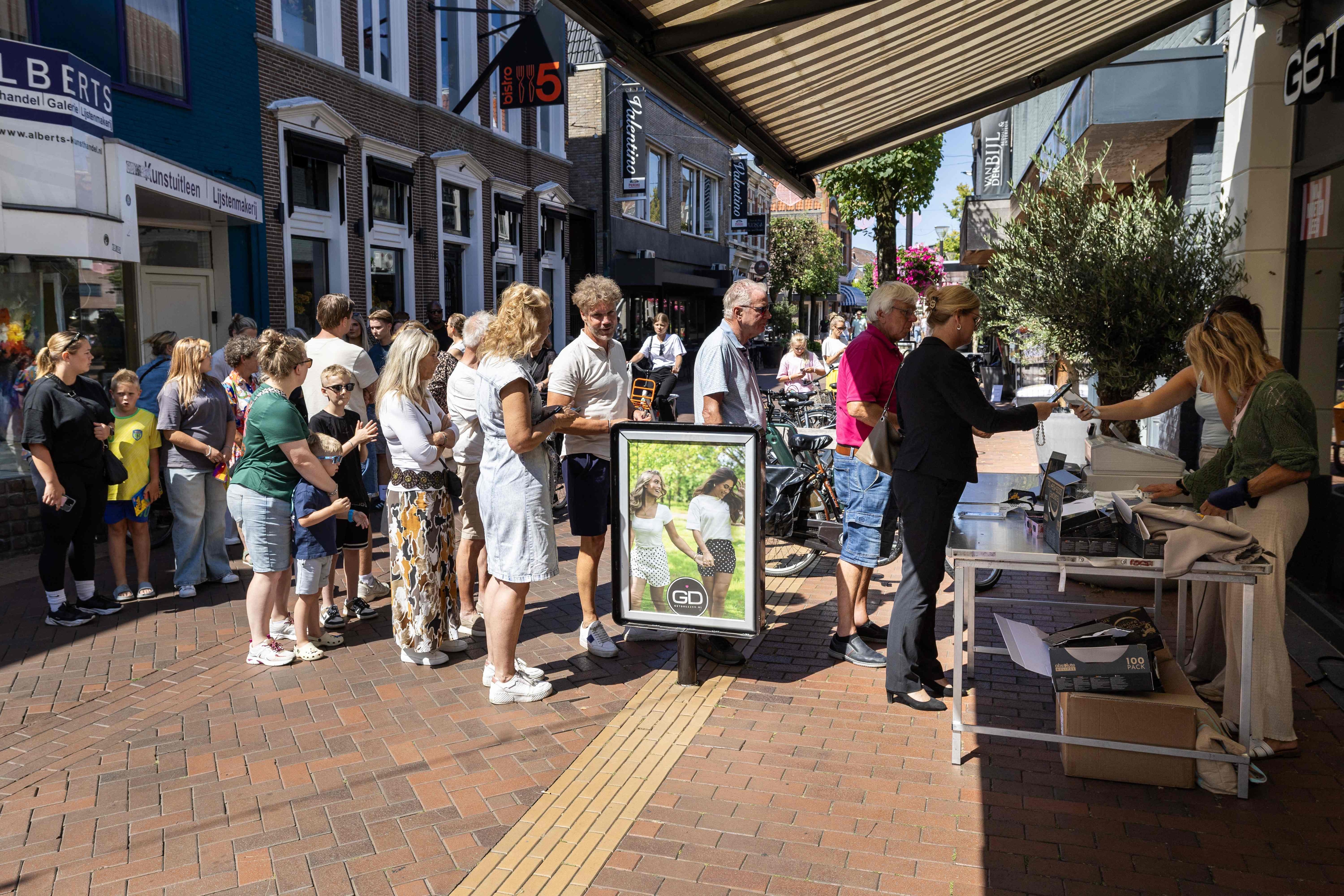 Customers wait in line for the sale of eclipse glasses in Almelo. (AFP Photo) Customers wait in line for the sale of eclipse glasses in Almelo. (AFP Photo)