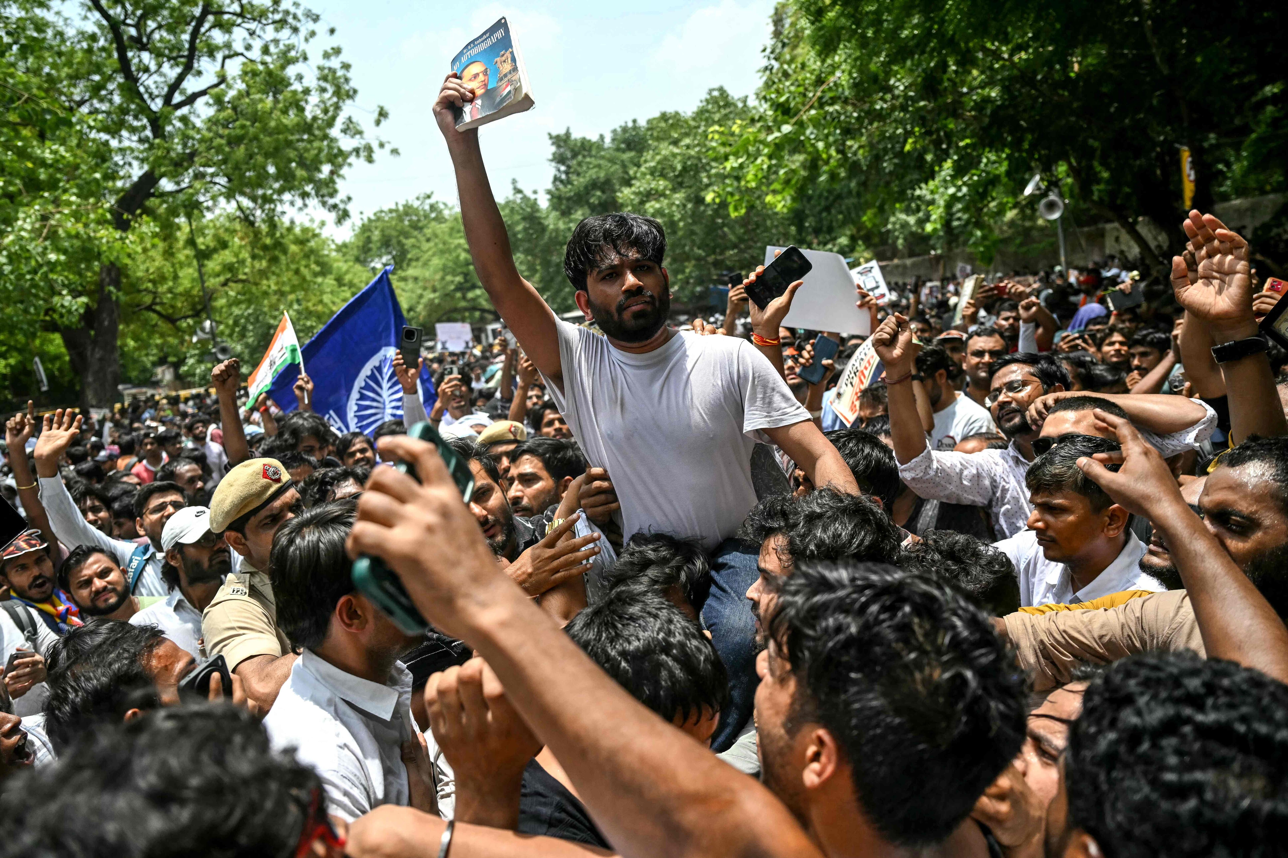 CJP founder Abhijeet Dipke (C) during the protest over NEET paper leak at Jantar Mantar. (AFP) CJP founder Abhijeet Dipke (C) during the protest over NEET paper leak at Jantar Mantar. (AFP)