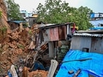 A peepal tree on the hillside was uprooted and came down along with mud and other debris, destroying four slum homes and damaging three others (Raju Shinde/HT Photoi)