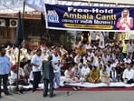 Chitra Sarwara on Wednesday staged a protest at Sadar Bazar Chowk, demanding a permanent solution to the long-standing issue of ownership rights over land and properties in Ambala Cantt (HT Photo)