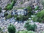 Four people were killed while 9 others were injured after the Bolero Camper they were travelling in plunged into a gorge on the Sangrah-Palar road in the Renukaji area of Sirmaur district late Tuesday night (HT Photo)