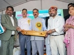 Himachal Pradesh Chief Minister Sukhvinder Singh Sukhu during an event with the fishing community, comprising the financial distribution to beneficiaries and the announcement of various projects, in Bilaspur on Wednesday. (ANI)