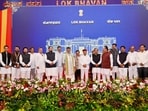 Karnataka chief minister DK Shivakumar and Governor Thawar Chand Gehlot pose with newly inducted ministers and other leaders after the swearing-in ceremony following the expansion of the state Cabinet at Lok Bhavan in Bengaluru. (X/DKShivakumar)