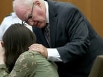Defense attorney Kevin Reddington consoles his client, Lindsay Clancy, as she sobs during her murder trial at Plymouth Superior Court in Plymouth, Mass., Wednesday, Aug. 12, 2026. (Mark Stockwell/Boston Herald via AP, Pool)