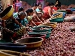 Navi Mumbai, India - August 23, 2023: Workers sort oions at a cold storage in Bajrang ice factory & Cold storage, after Union Government imposed 40 percent duty on exports of onions at Sector -18 Vashi, in Navi Mumbai, India, on Wednesday, August 23, 2023. (Photo by Bachchan Kumar/ HT PHOTO) (HT PHOTO)