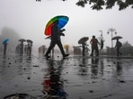 Shimla: People move along the road amid monsoon rain, in Shimla, Himachal Pradesh, Tuesday, Aug. 11, 2026.